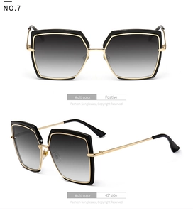 Front and 45-degree angle view of oversized black sunglasses with gold metal temples