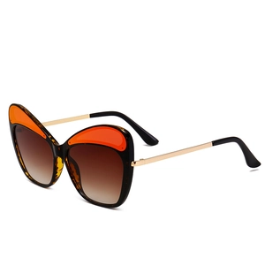 Tortoiseshell butterfly sunglasses with golden metal temples and gradient brown lenses