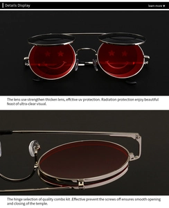 Détail de lunettes de soleil steampunk à clapet avec verres rouges smile et cadre argent