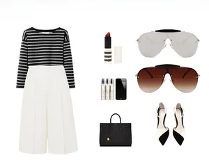 Flat lay of oversized pilot sunglasses paired with elegant business casual office wear