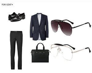 Flat lay of business casual outfit including navy pinstripe suit and oversized sunglasses