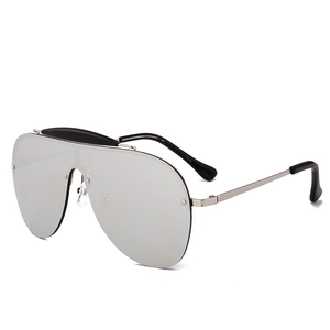 Oversized silver shield sunglasses with black top bar and sleek metal temples