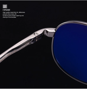 Macro shot of silver metal hinges and blue lenses on polarized square sunglasses