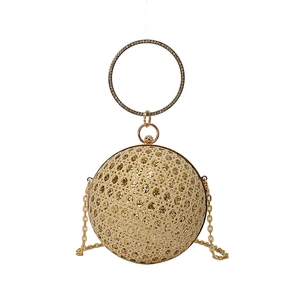 Luxurious gold sphere evening clutch bag with diamond ring handle and chain strap