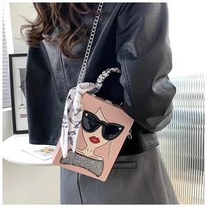 Pink box bag featuring cartoon girl print with silk scarf handle and silver chain strap