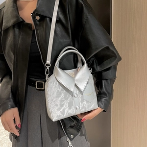 Unique silver shirt-shaped handbag with button detail and crossbody strap for women