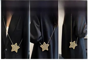 Detail of star-shaped crossbody bag with gold woven texture and detachable chain strap