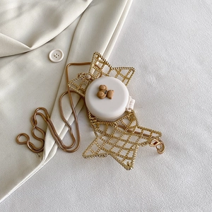 White circular mini bag with gold star metal frame and cute bear charm on chain