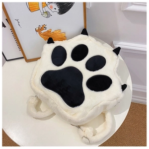 Detailed view of the soft plush cat paw backpack featuring furry straps and metal rings