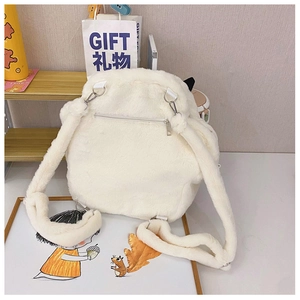 Detail of white plush cat paw backpack featuring back zipper pocket and soft straps