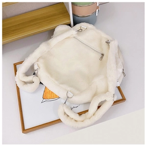 Detail view of white plush backpack featuring a secure back zipper pocket and furry straps