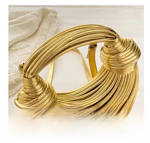 Detailed view of the comfortable golden woven handle with intricate knotted design