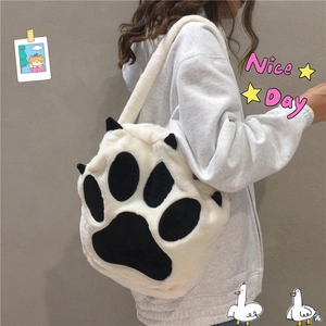 Plush white cat paw tote bag with black ear details and fuzzy shoulder strap