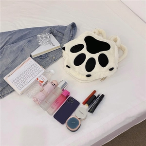 White plush cat paw backpack showing large storage capacity with daily essentials