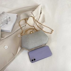 Elegant silver glitter evening bag with pearl top handle and golden crossbody chain