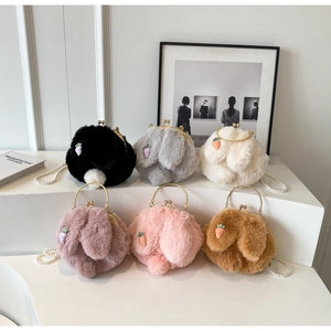 Detail of plush rabbit ear bags in six colors with carrot embroidery and pearl straps
