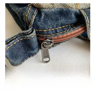 Detail of premium SBS metal zipper and contrast stitching on vintage denim tote bag