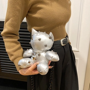 Silver metallic bear cross-body bag with rivet studs and a black chunky chain strap