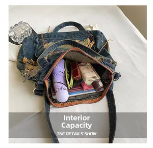Top-down view showing large capacity denim tote bag with daily essentials inside