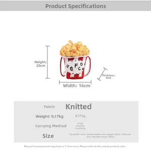 Detail view of handmade popcorn bucket knit bag with red stripes and 3D popcorn texture