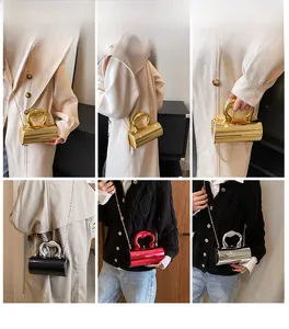 Fashionable cylinder handbag with heart-shaped handle shown in multiple styles