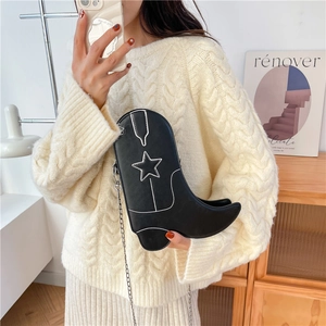 Creative black boot-shaped crossbody bag with white stitching and silver chain