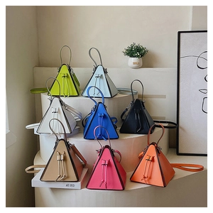 Detail view of colorful triangular PU leather handbags with drawstring and thin handles