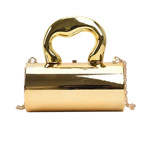 Modern gold cylindrical hard-shell box bag with sculptural handle and metal chain strap