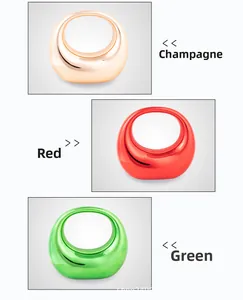 Detailed view of glossy acrylic dumpling bags in champagne, red, and green colors