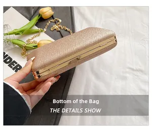 Detail showing the bottom structure and glitter texture of champagne evening clutch bag