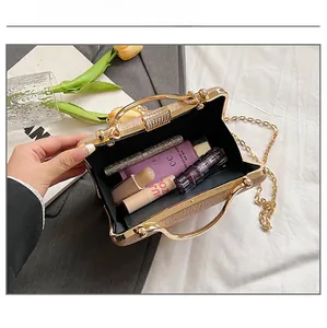 Golden sequin evening bag showing interior capacity for lipstick and makeup items