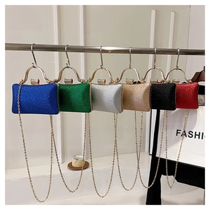 Glitter evening clutches in multiple colors featuring metal handles and chain straps