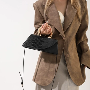 Retro black crocodile pattern crossbody bag with a distinctive golden metal handle for women