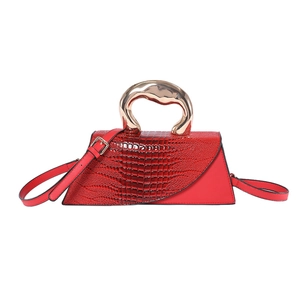 Red crocodile texture handbag with unique gold metal handle and asymmetric flap