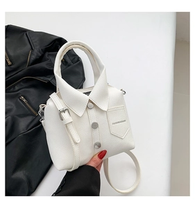 Detail of creative shirt-shaped white handbag with litchi texture and rivet accents