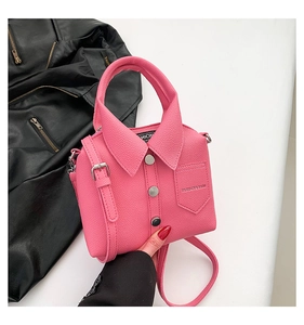 Pink shirt-shaped bag with collar detail, metal buttons and pebble grain texture