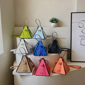Modern triangular handbag in candy colors with drawstring closure and slim shoulder strap