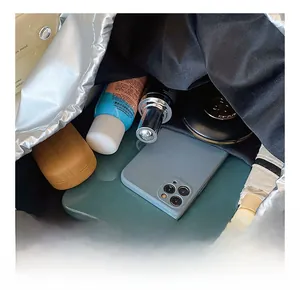 Spacious interior of silver backpack showing tablet and daily essentials storage