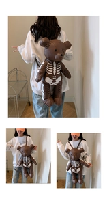 Detail of teddy bear backpack featuring white skeleton print and brown PU leather