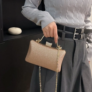 Sparkling champagne gold sequined evening clutch bag with rhinestone clasp and chain strap