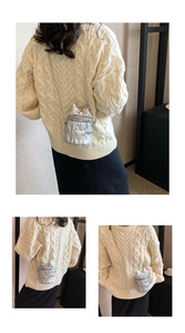 Détail du mini sac seau argenté avec matelassage cœur et nœud sur bandoulière chaîne
