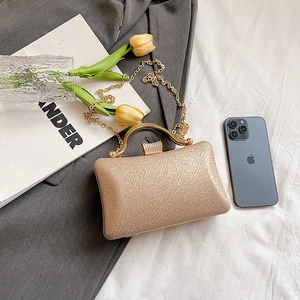 Elegant champagne gold sequin evening clutch bag with round metal handle and chain strap
