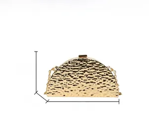 Detail view of a gold crescent clutch with hammered texture and dimensions 20x12x4cm