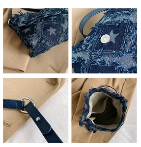 Detail view of denim crossbody bag showing star patch, magnetic closure and inner pocket