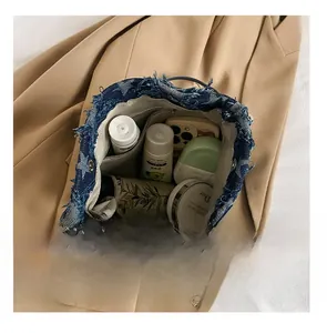 Internal view of blue denim star bucket bag showing spacious storage for daily items