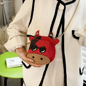 Mini red cartoon cow crossbody bag with gold chain strap for women, modern 2025 style