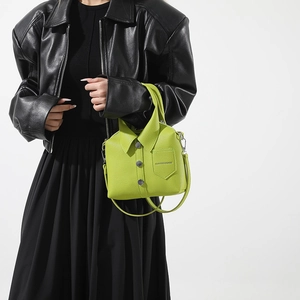 Neon green shirt-shaped crossbody bag with rivet details and decorative pocket