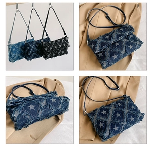 Detail of denim crossbody bag with star quilting and distressed fringe edges