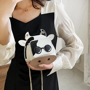 Cute cow pattern mini crossbody bag with gold chain strap and 3D cartoon details