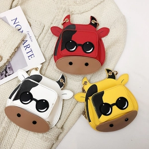 Mini cartoon cow crossbody bags with sunglasses detail and gold chain in red, white and yellow